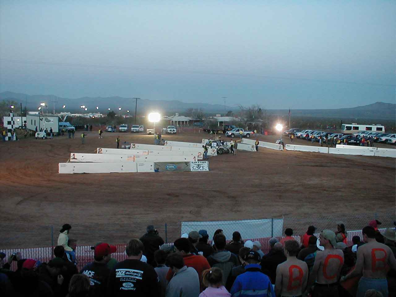 DARPA's robot race got underway in the pre-dawn hours. Starting chutes were
                  fashioned from concrete bunkers. Once an official waved a green flag,
                  the vehicle had 30 seconds to get out the starting gate.