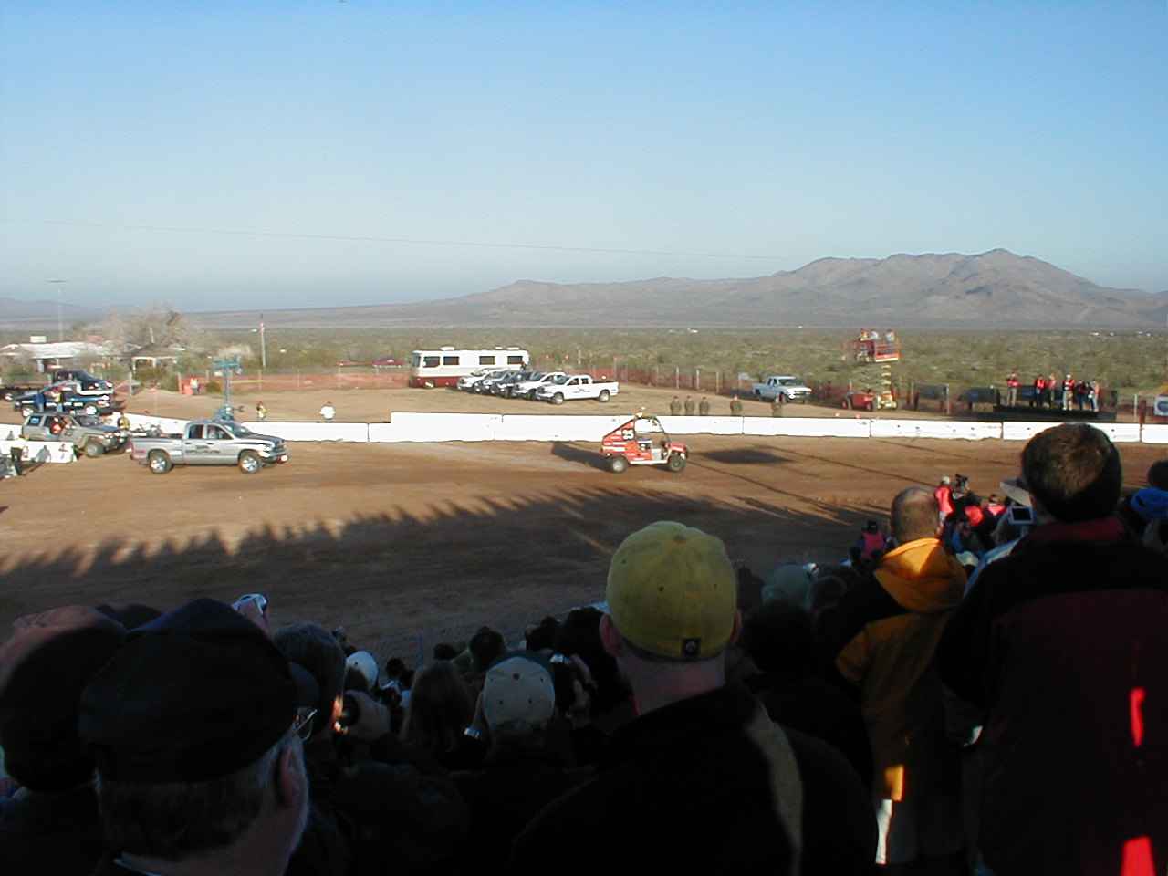 Virginia Tech's vehicle bolts out of the starting gate, followed closely by
                  the control vehicle, which was manned by a DARPA official to watch
                  the autonomous vehicle and stop it if got into a dangerous situation